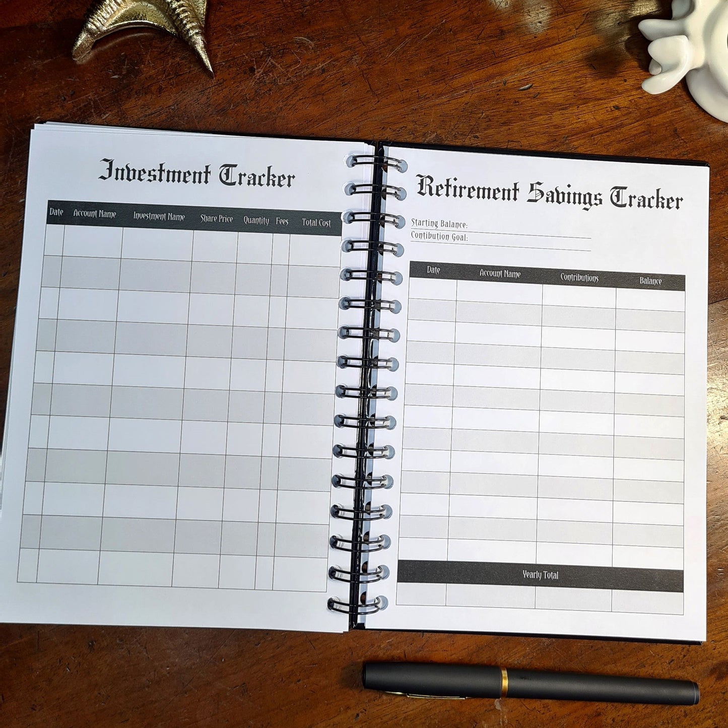 A two-page layout inside the Financial Planner by Gothic Office. The left page is an Investment Tracker and the right is a Retirement Savings Tracker.
