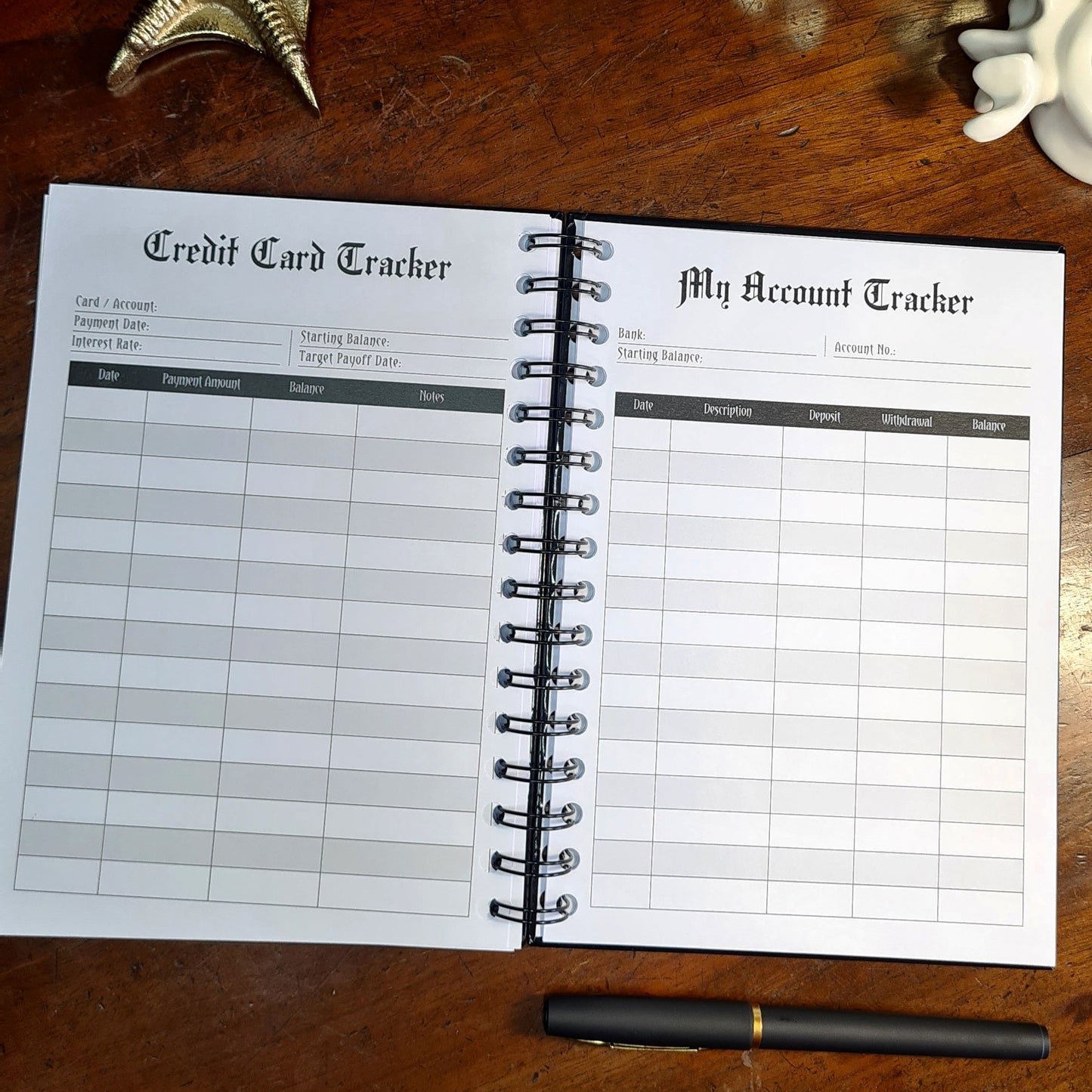A two-page layout inside the Financial Planner by Gothic Office. The left page is a Credit Card Tracker and the right page is My Account Tracker.