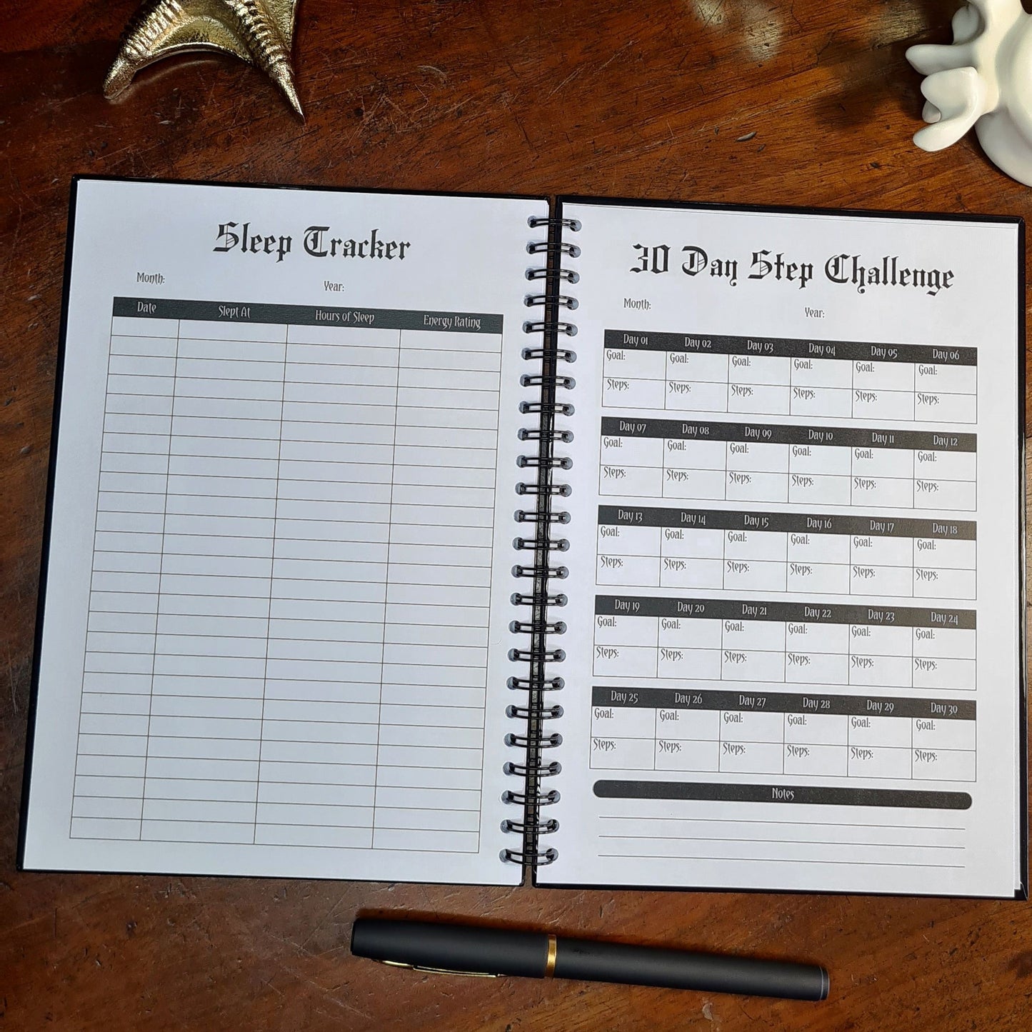 A two page layout inside the Fitness Planner by Gothic Office. The left page is a Sleep Tracker and right is a 30 Day Step Challenge.