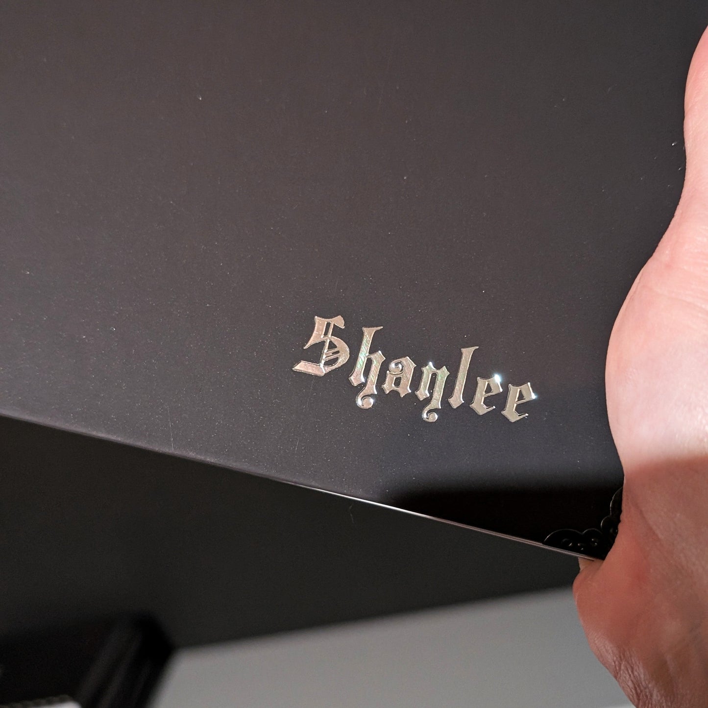 A close up of a Gothic Office planner with silver embossing of the word Shaylee.