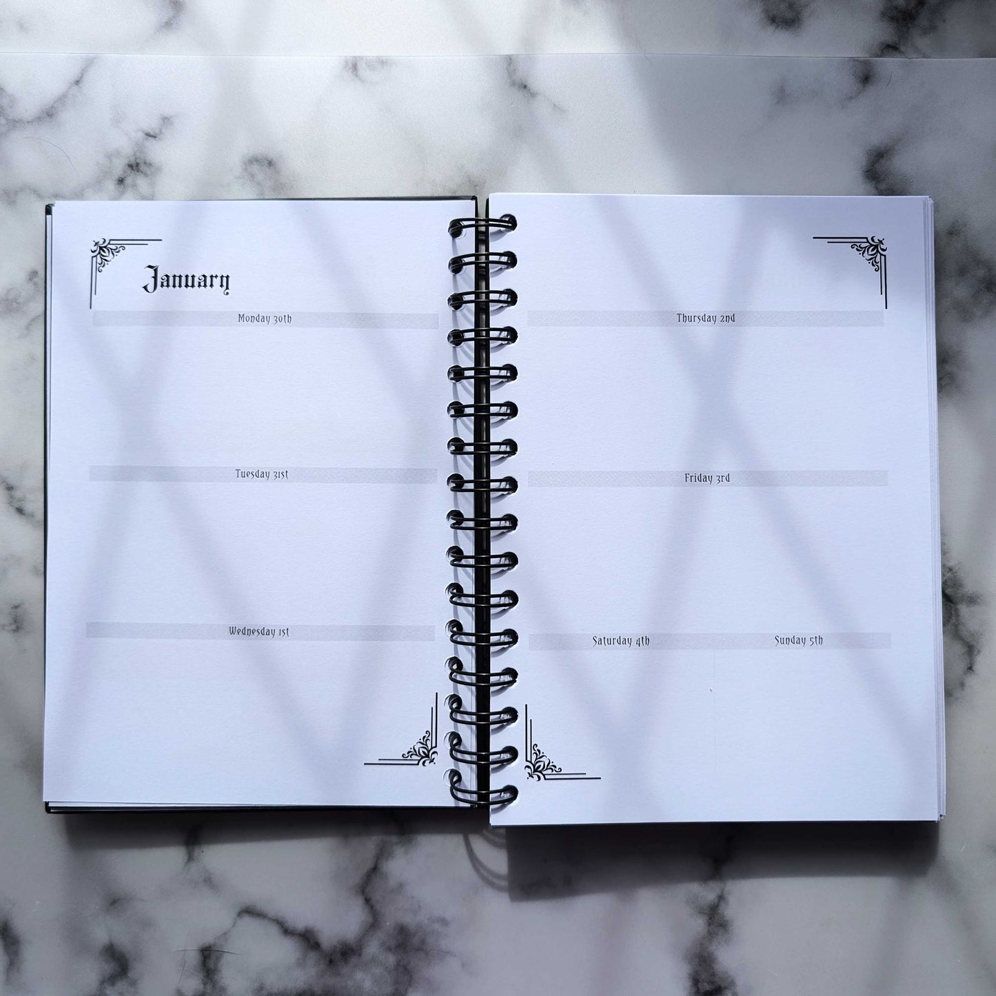 A two page layout inside the 2025 Planner by Gothic Office.  These two pages are the Weekly layout with Monday, Tuesday and Wednesday on the left and Thursday, Friday, Saturday and Sunday on the right.