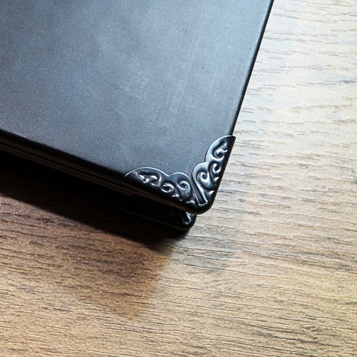 A close up of the metal corners on the Gothic Office Planner.