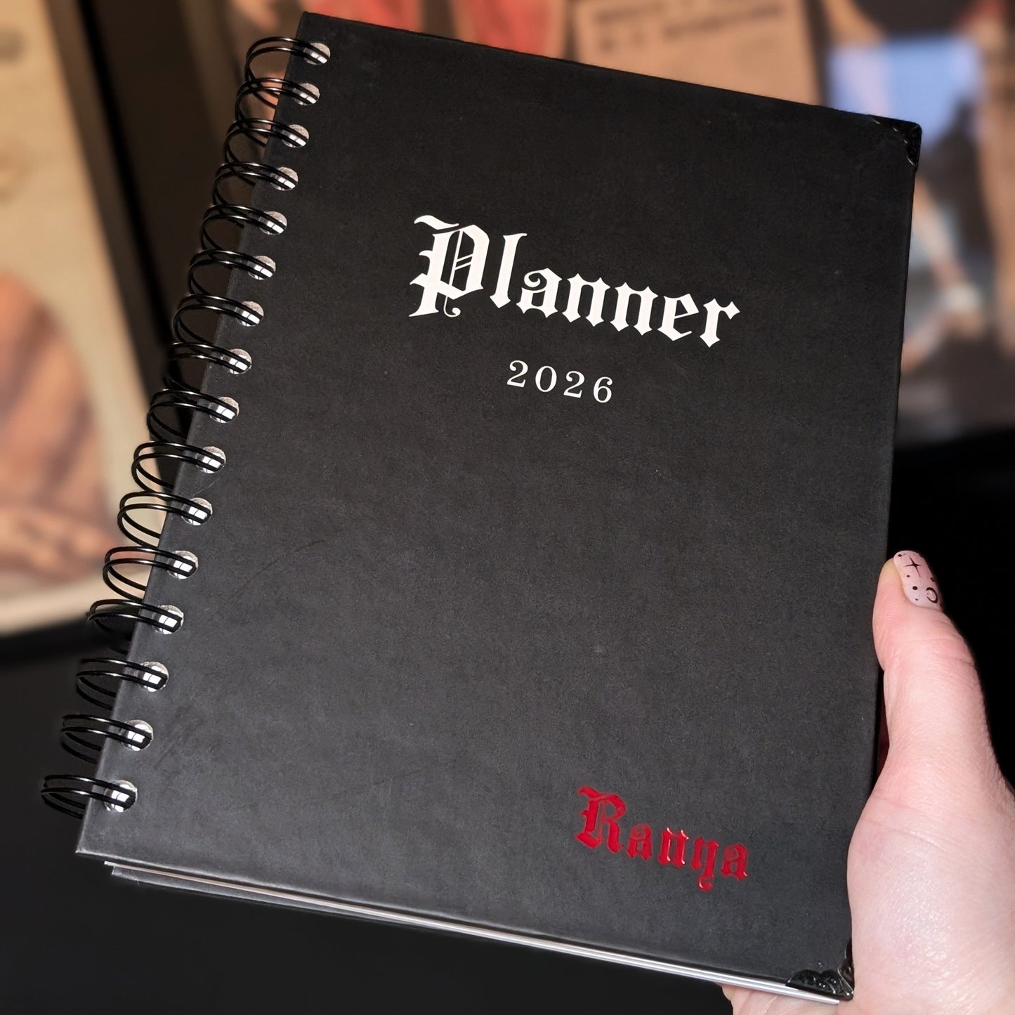 A close up of a Gothic Office planner with Red embossing of the word Ranya.