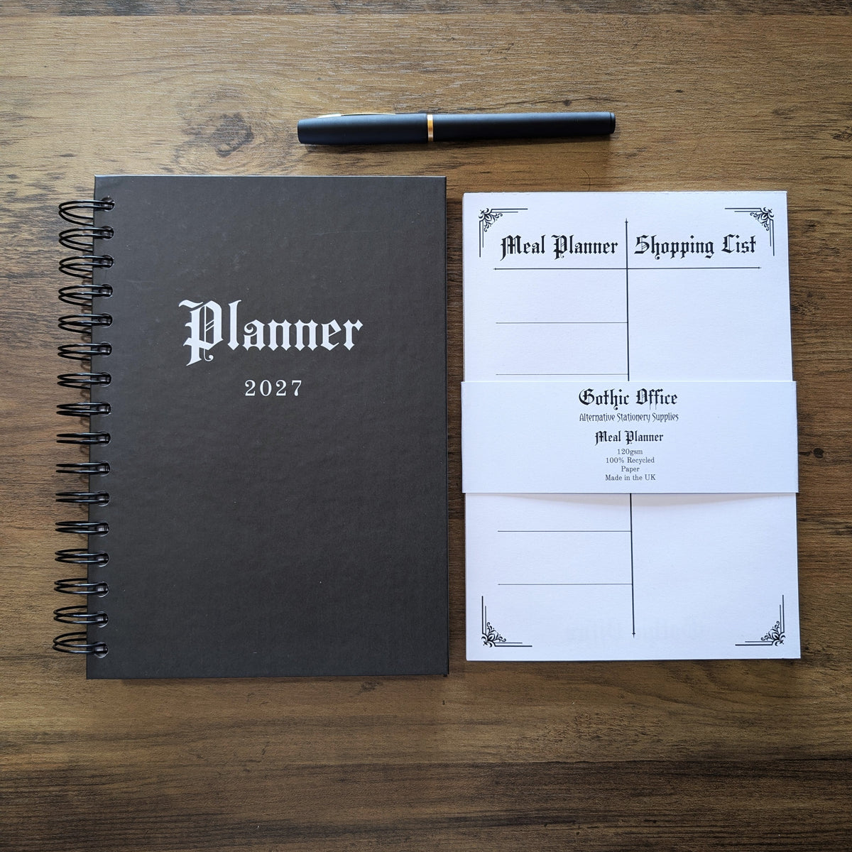 The Gothic Office 2027 Planner next to the Meal Planner & Shopping List Notepad. 