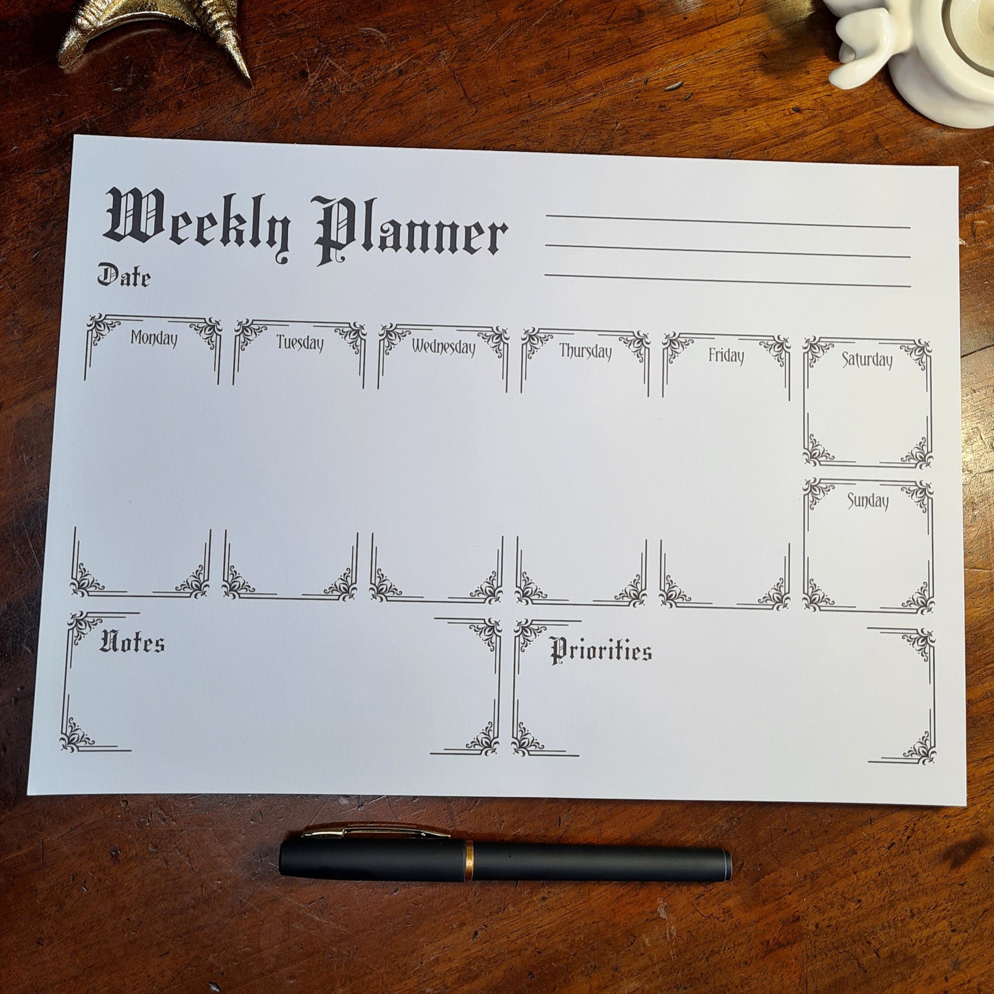 A Weekly Planner Notepad in a Gothic Style. 50 pages with spaces for each day of the week, Notes and Priorities. Product by Gothic Office.