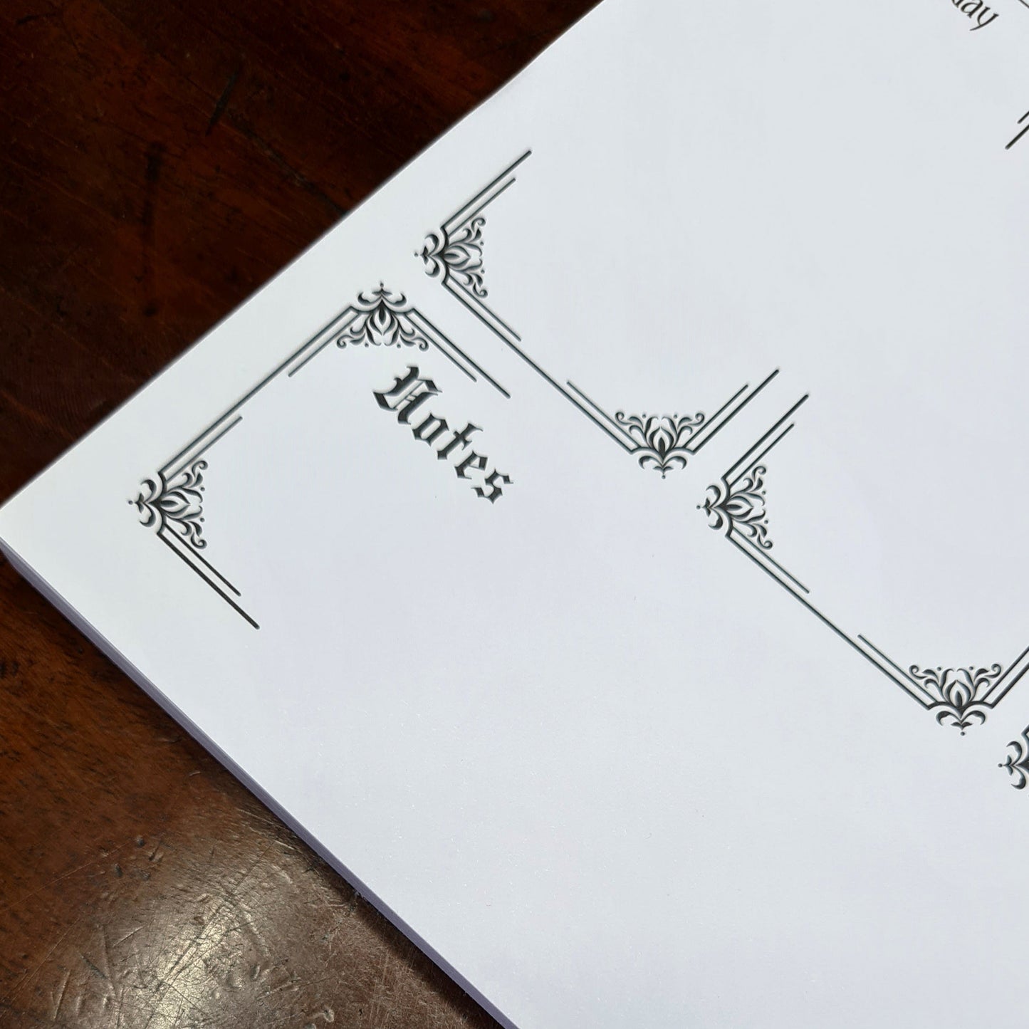 A Weekly Planner Notepad in a Gothic Style. 50 pages with spaces for each day of the week, Notes and Priorities. Product by Gothic Office.