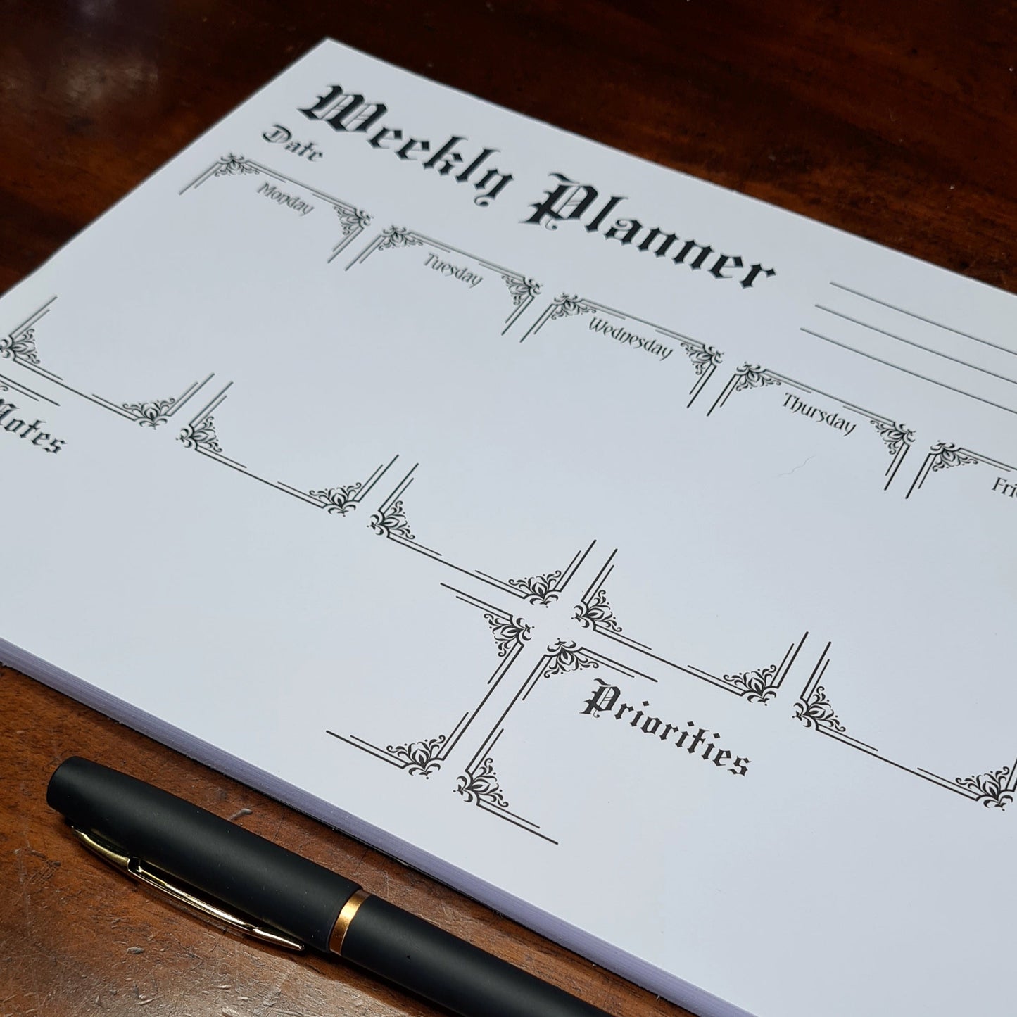 A Weekly Planner Notepad in a Gothic Style. 50 pages with spaces for each day of the week, Notes and Priorities. Product by Gothic Office.